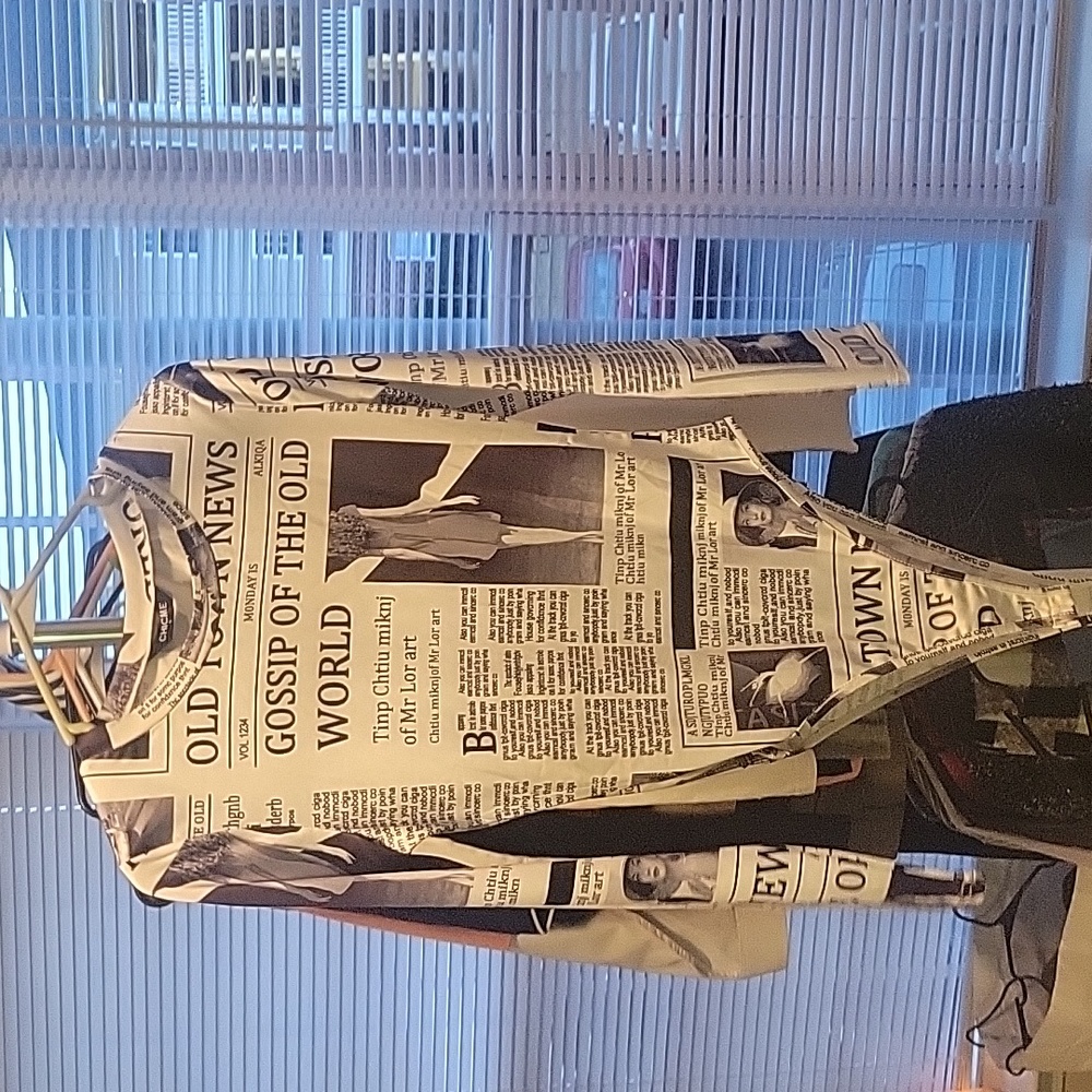 Newspaper body suit never worn